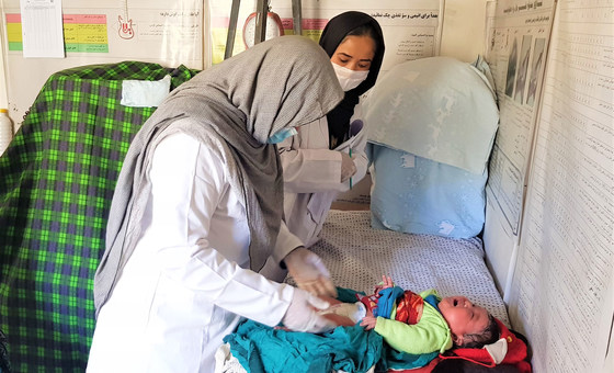 A midwife at a family health house in Daikundi, Afghanistan, provides care to a baby (file photo). 