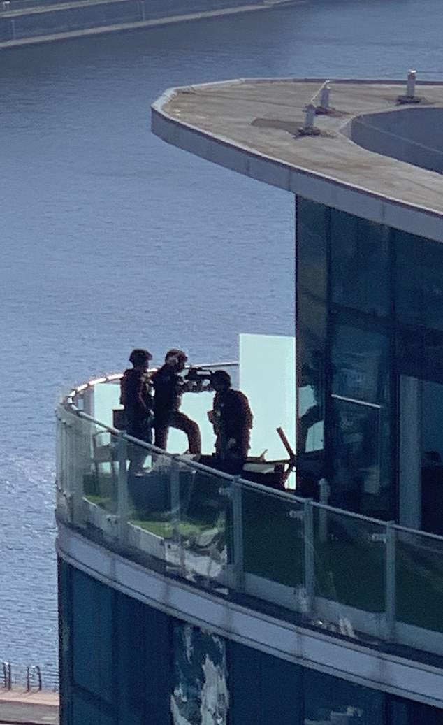 Armed police move in moments before he is arrestedduring the first pandemic lockdown