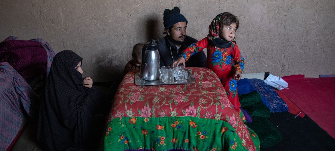 A family drinks tea at home in Herat, Afghanistan.
