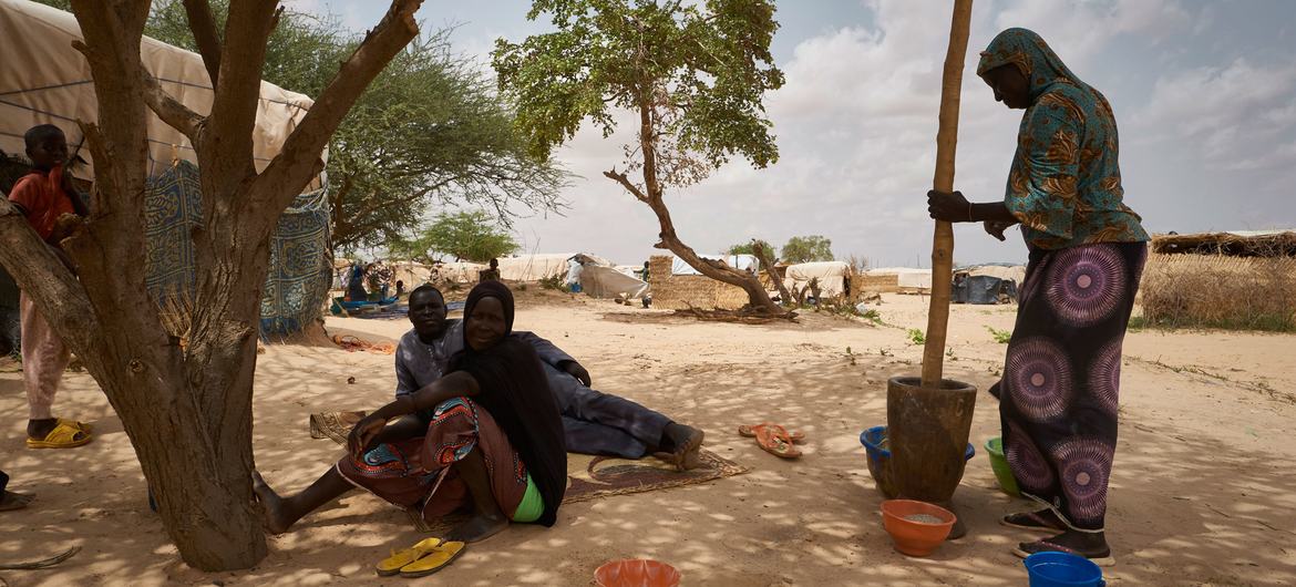 Refugee women prepare food in a displacement site in Ouallam, in the Tillaberi region of Niger.